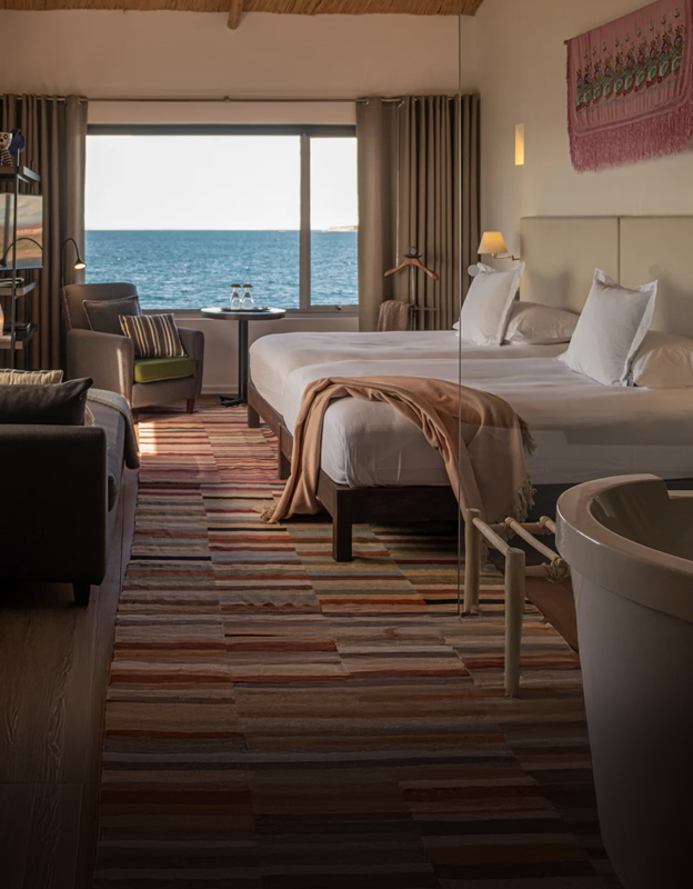 Luxury lakeside room at Titilaka Hotel overlooking Lake Titicaca, Peru